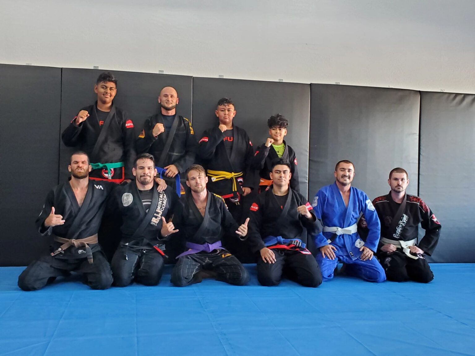 Adult Brazilian Jiu Jitsu team photo with belts